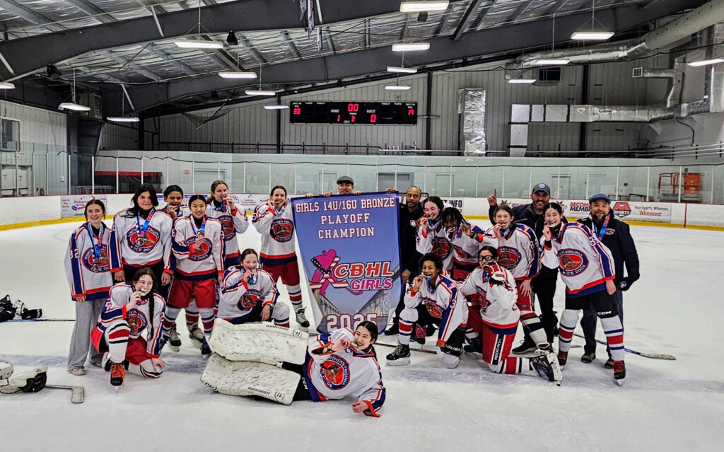 Girls team with a banner to celebrate the CBHL 14U/16U Bronze championship