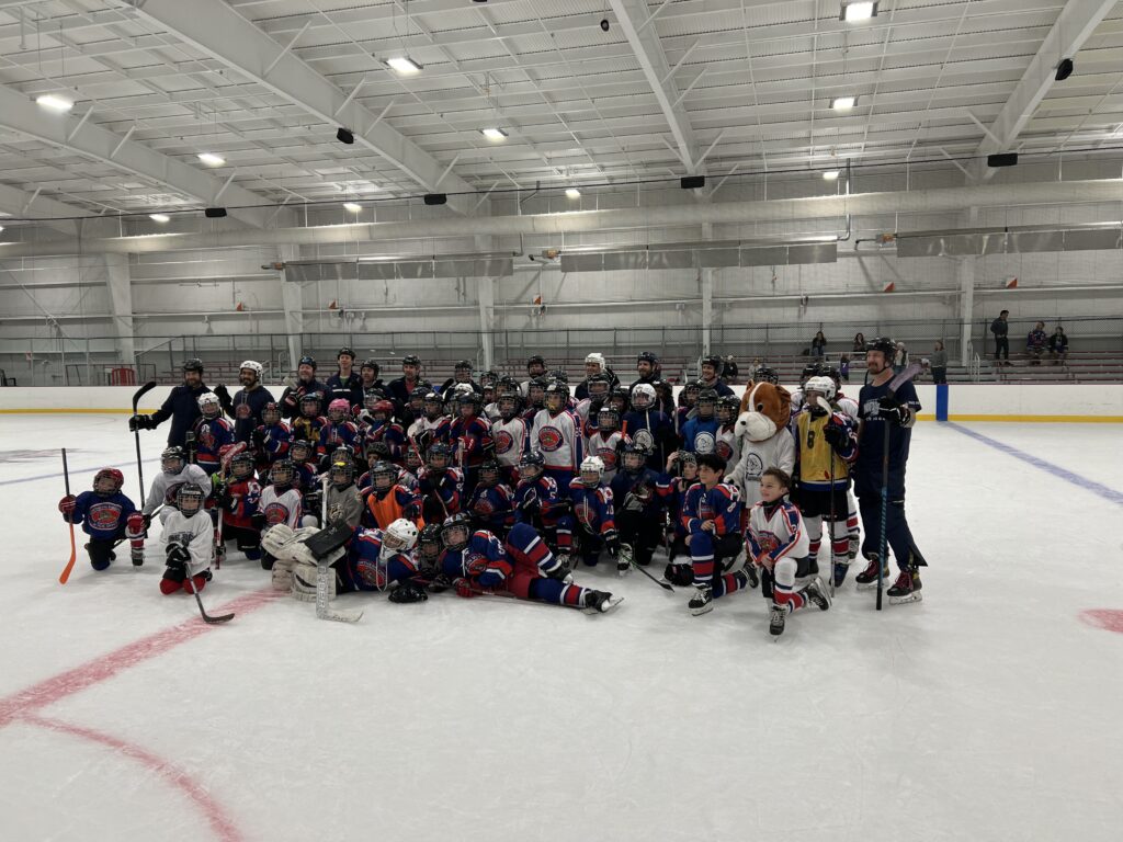 Players on the ice for Ice Dog Night 2024